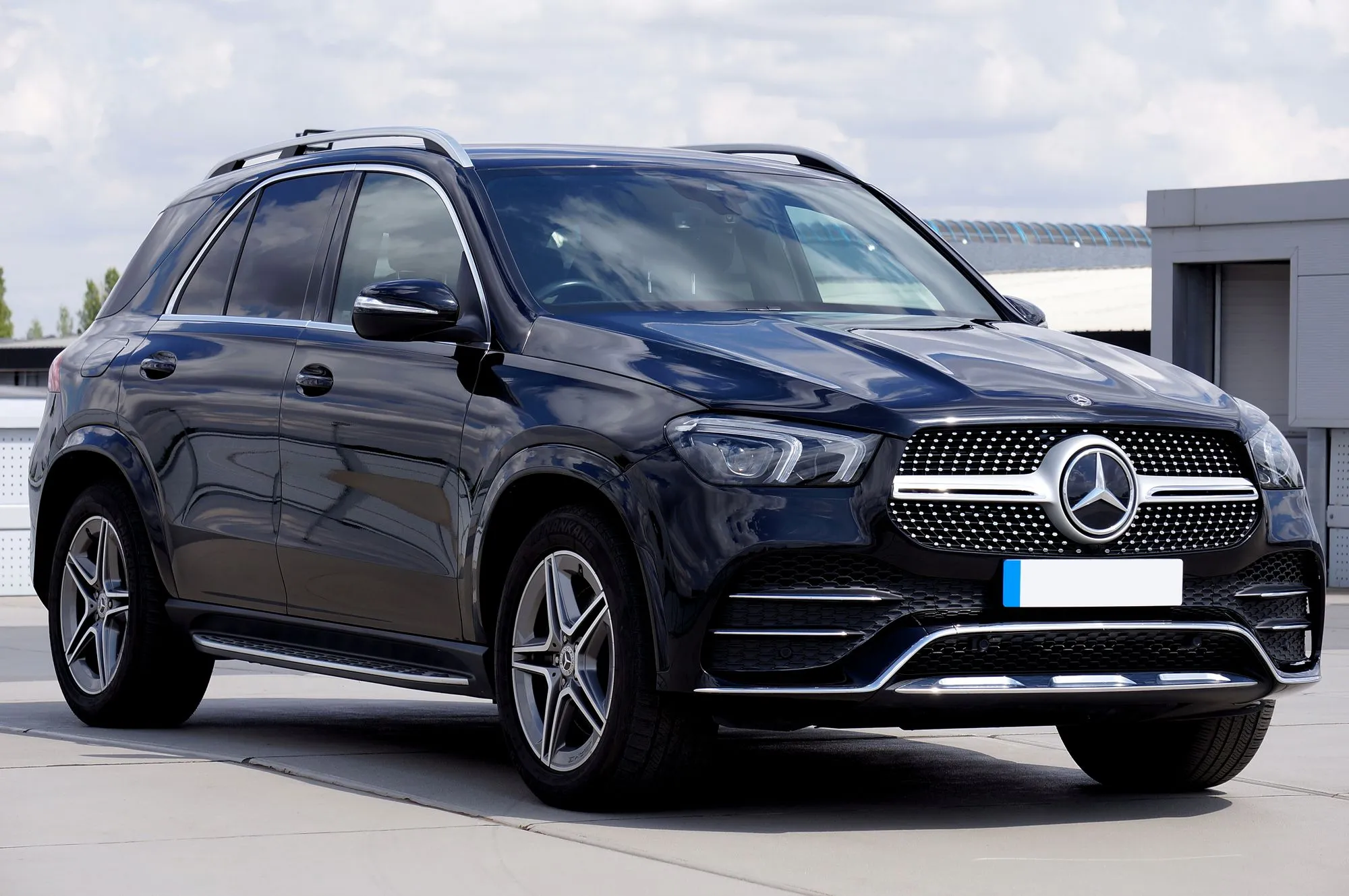 A black Mercedes-Benz GLE photographed from the front three-quarter angle